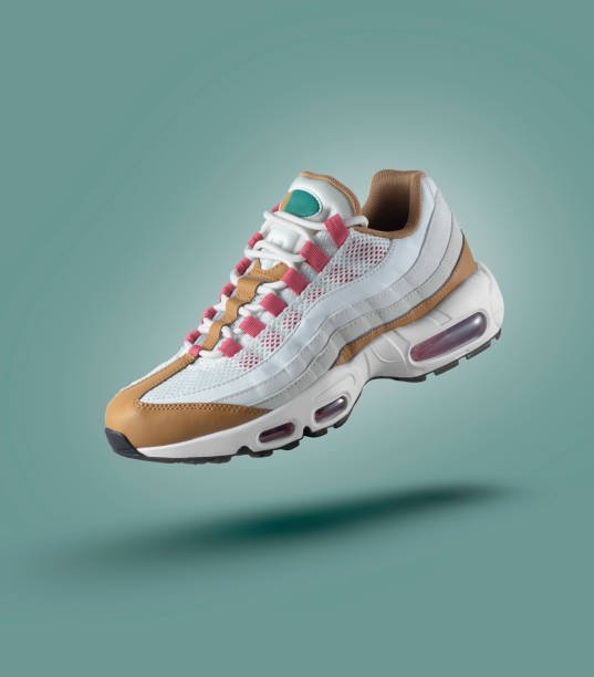 White sneaker with colored accents on a green gradient background, men's fashion, sport shoe, air, sneakers, lifestyle, concept, product photo, levitation concept, street wear, trainer